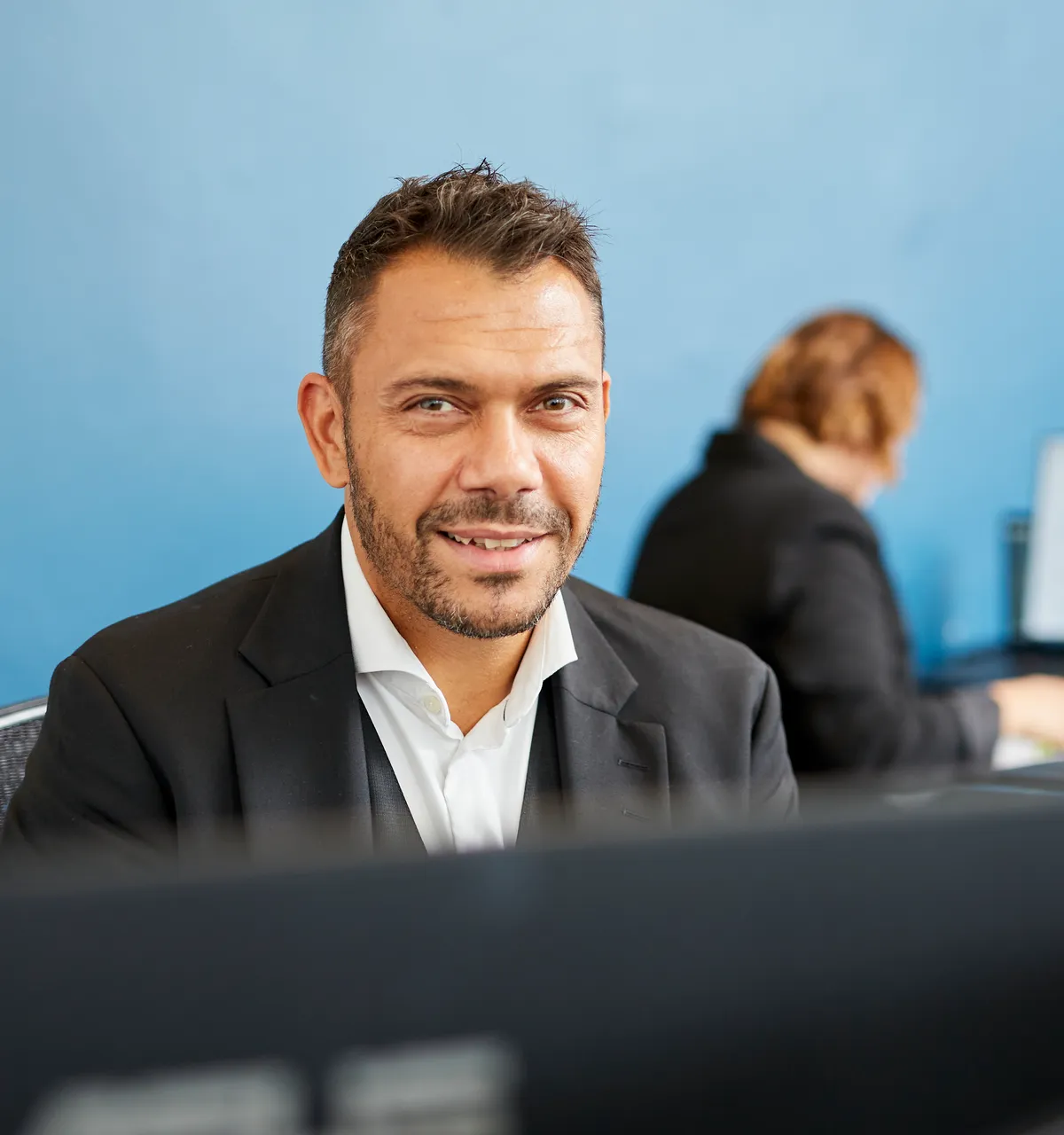 A member of the Rieck team at their desk